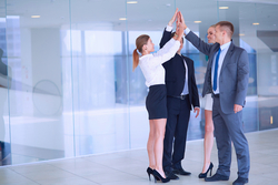 Leaders high-fiving in a great company culture